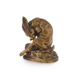 CLOVIS-EDMOND MASSON (FRENCH, 1838-1913), A GILT BRONZE MODEL OF A HARE GROOMING ITS BACK LEG