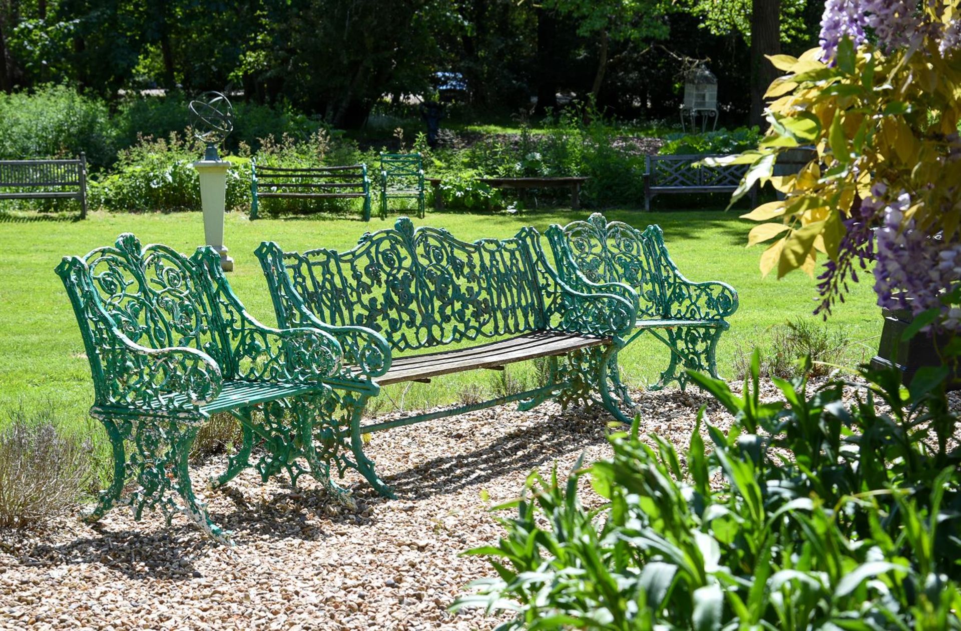 A GREEN PAINTED CAST IRON BENCH, LATE 19TH CENTURY