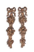 A PAIR OF CARVED LIMEWOOD WALL HANGINGS, ATTRIBUTED TO MARSH, JONES & CRIBB, LATE 19TH CENTURY