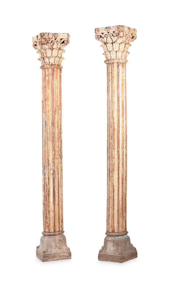 A PAIR OF CARVED WOOD AND PAINTED CORINTHIAN COLUMNS ON STONE PLINTHS, 19TH OR 20TH CENTURY