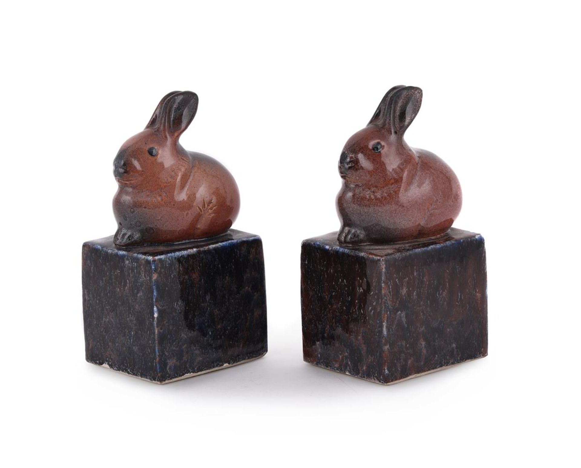 L FRANCE, A PAIR OF GLAZED PORCELAIN RABBIT BOOKENDS