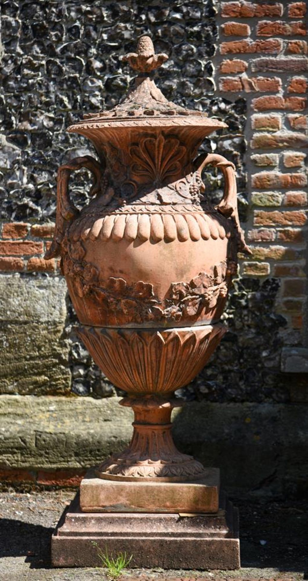 A PAIR OF LARGE TERRACOTTA COLOURED COMPOSITION STONE GARDEN URNS, 20TH CENTURY - Image 2 of 2