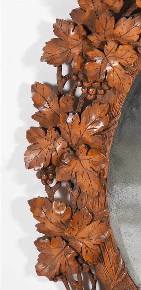 A GERMAN 'BLACK FOREST' CARVED SOFTWOOD OVAL MIRROR, LATE 19TH CENTURY - Image 3 of 5