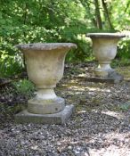 A PAIR OF BATH STONE SOLID VASES, 19TH CENTURY