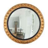 A LARGE GILTWOOD CONVEX WALL MIRROR, IN REGENCY STYLE, LATE 20TH CENTURY