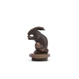 FRENCH SCHOOL, A BRONZE RADIATOR CAP MODELLED AS A STANDING RABBIT