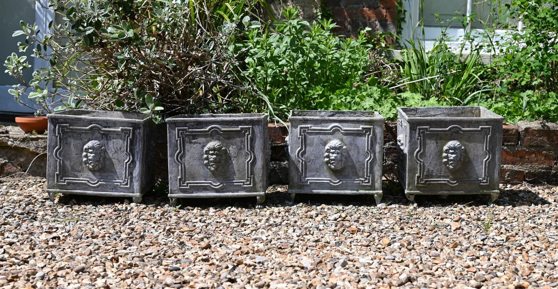 A SET OF FOUR SQUARE LEAD PLANTERS, 20TH CENTURY