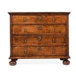 A QUEEN ANNE BURR WALNUT AND CROSSBANDED CHEST OF DRAWERS, CIRCA 1710