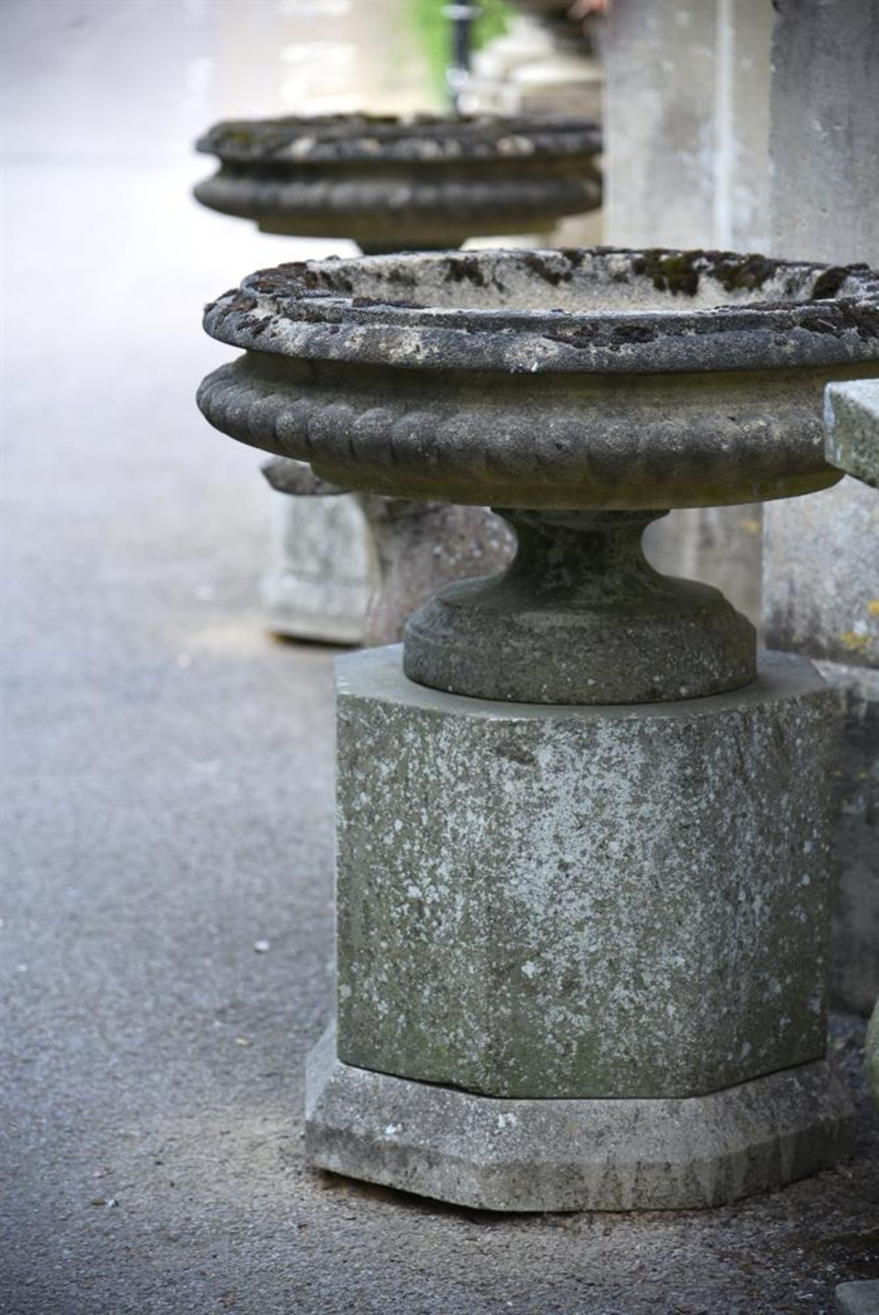 A PAIR OF COMPOSITION STONE TAZZA ON STANDS, MID/LATE 20TH CENTURY