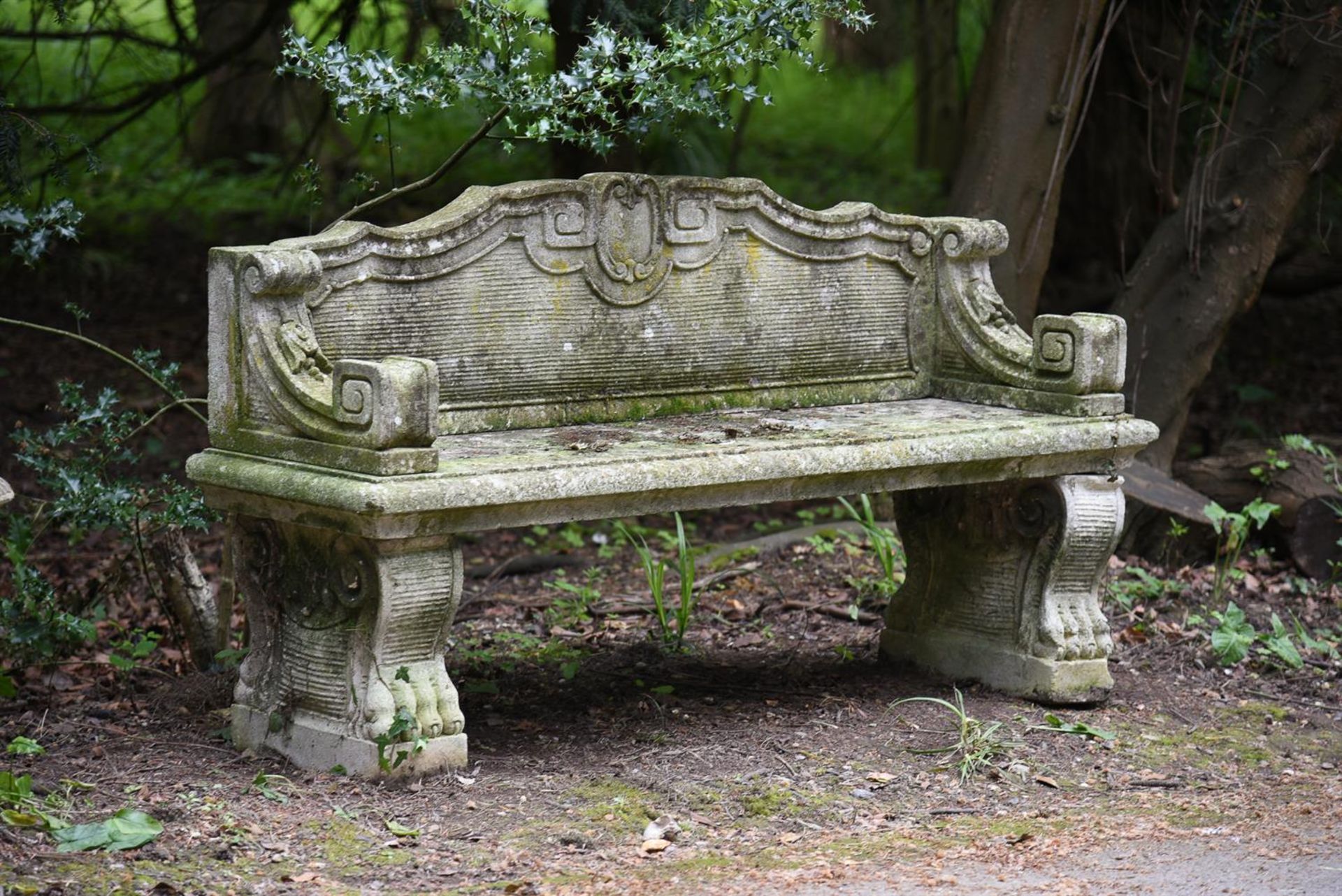 AN ITALIAN CARVED LIMESTONE BENCH, MODERN