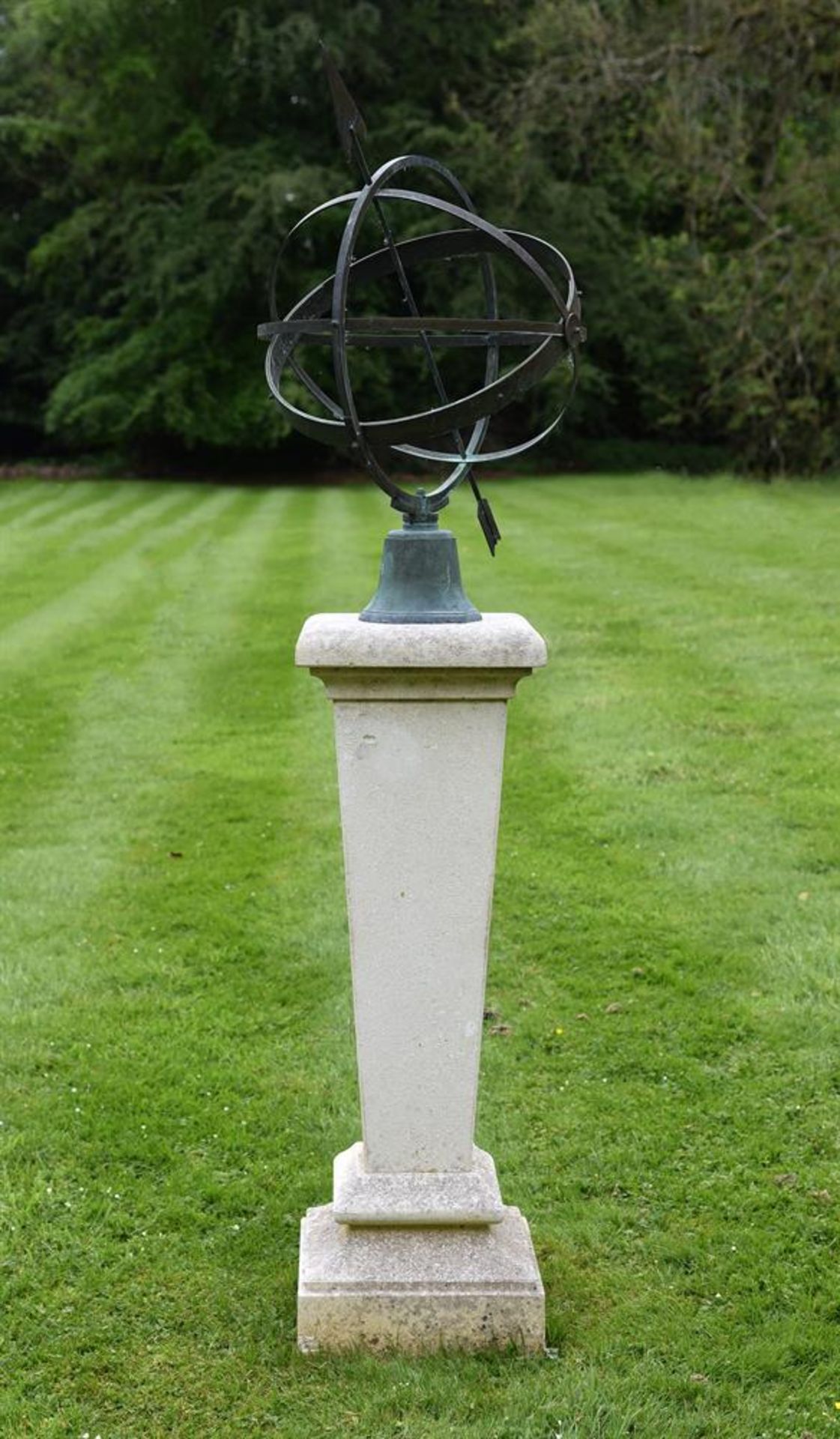 AN ARMILLARY SPHERE OR SUNDIAL ON A LIMESTONE PEDESTAL BASE, MODERN