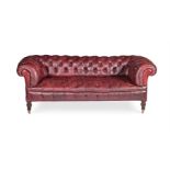 A VICTORIAN MAHOGANY AND LEATHER UPHOLSTERED CHESTERFIELD SOFA, IN THE MANNER OF JAMES SHOOLBRED