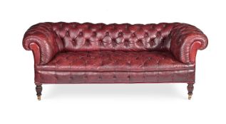 A VICTORIAN MAHOGANY AND LEATHER UPHOLSTERED CHESTERFIELD SOFA, IN THE MANNER OF JAMES SHOOLBRED