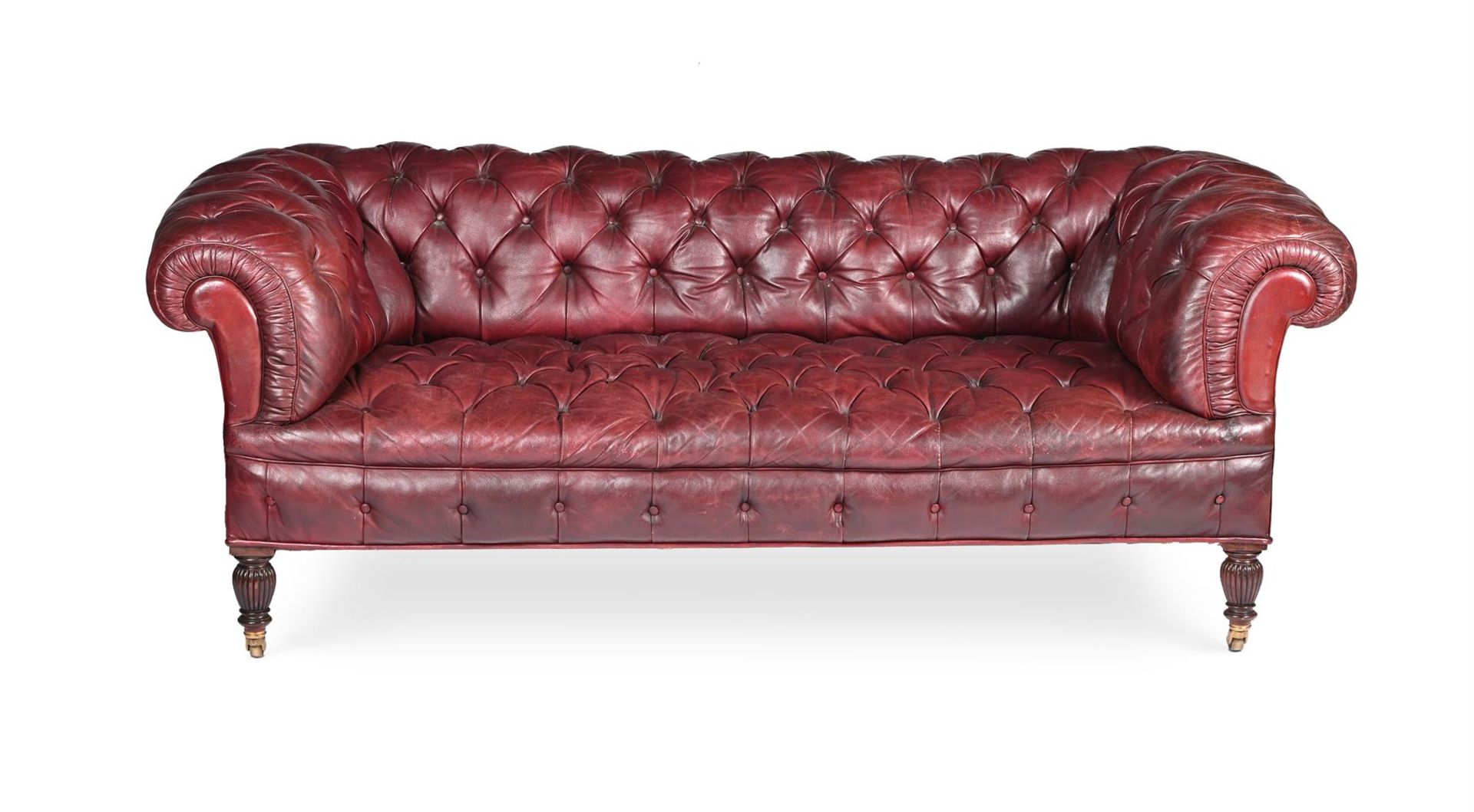 A VICTORIAN MAHOGANY AND LEATHER UPHOLSTERED CHESTERFIELD SOFA, IN THE MANNER OF JAMES SHOOLBRED