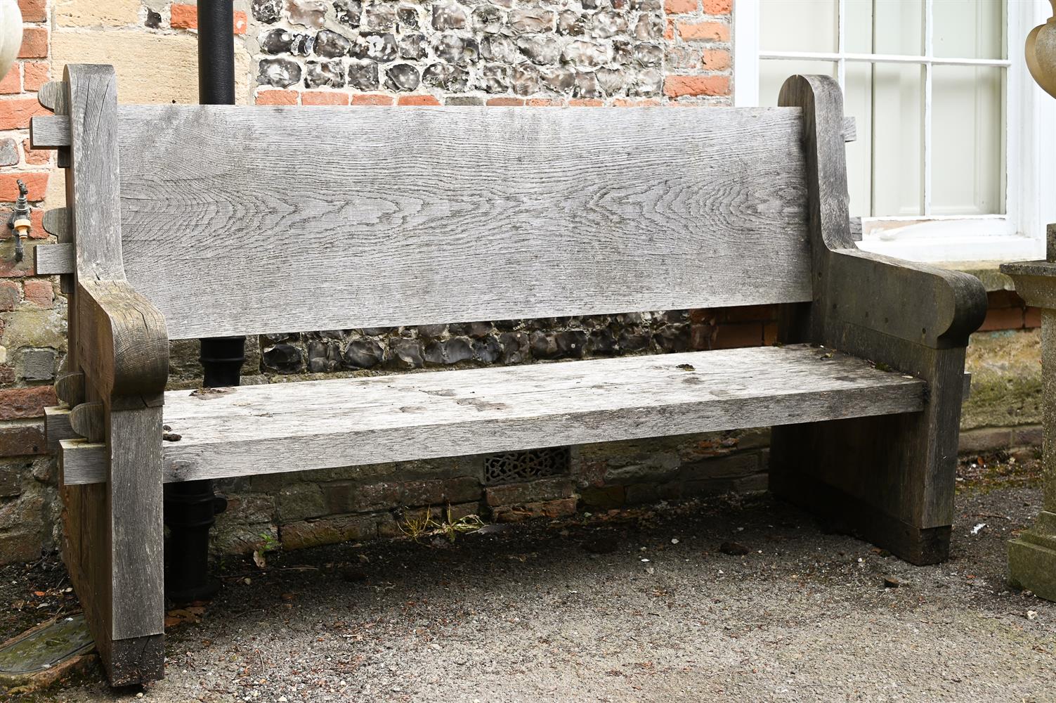 A LARGE ENGLISH OAK GARDEN BENCH, MODERN