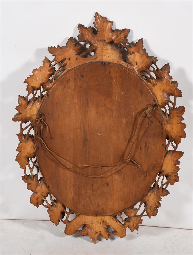 A GERMAN 'BLACK FOREST' CARVED SOFTWOOD OVAL MIRROR, LATE 19TH CENTURY - Image 4 of 5