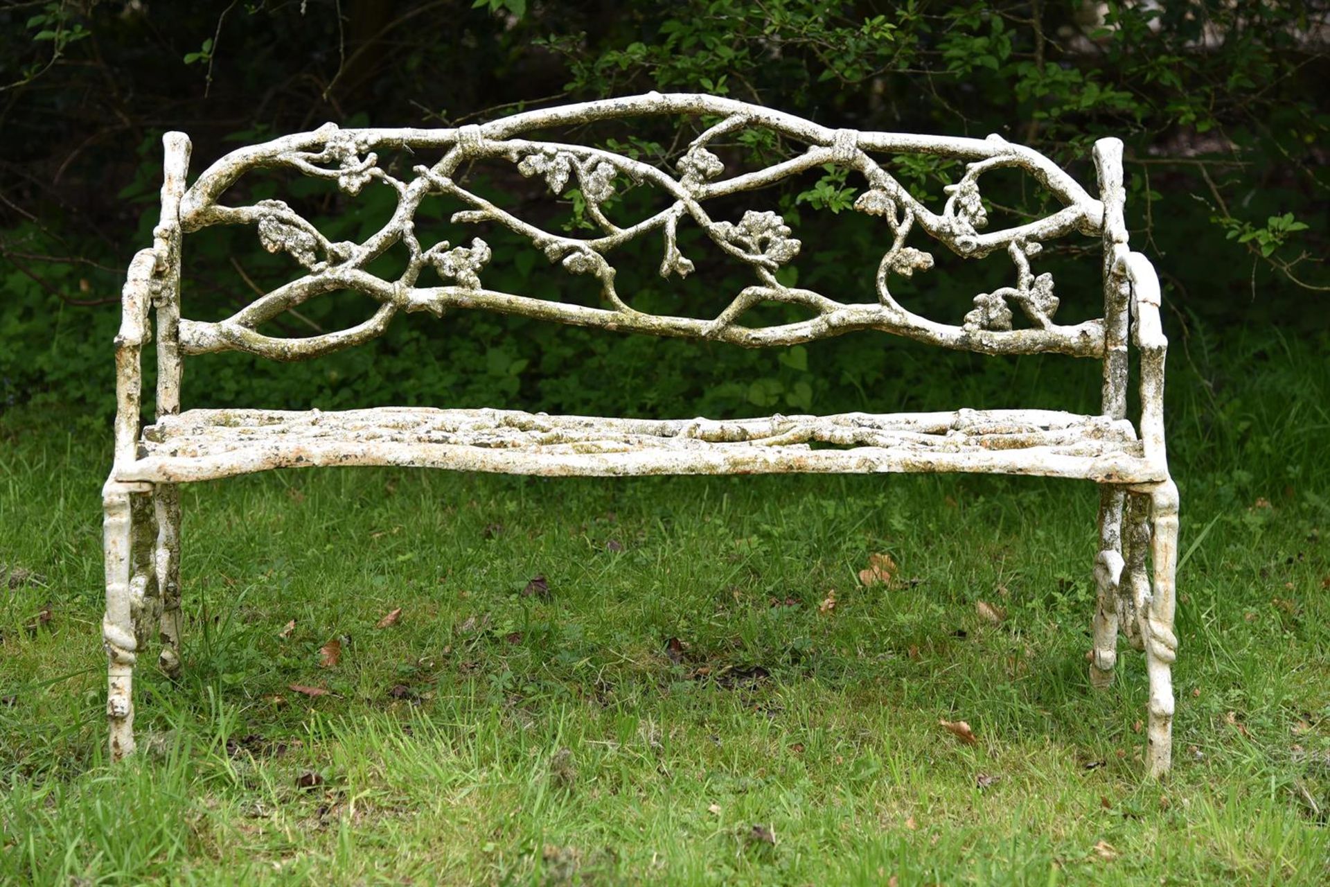 A WEATHERED WHITE PAINTED CAST IRON 'GARDEN BRANCH' BENCH, PROBABLY EARLY 20TH CENTURY - Image 2 of 3