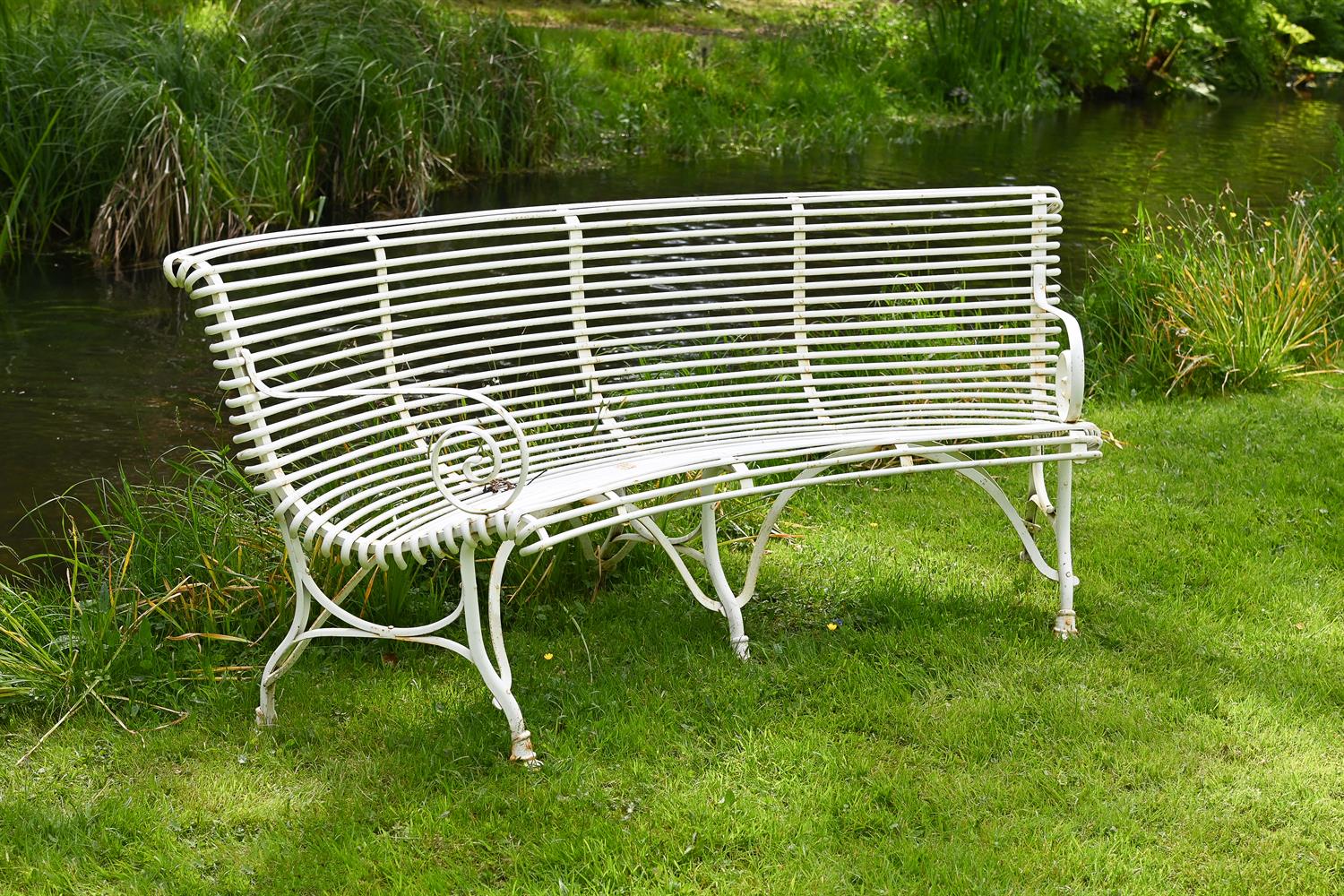 A HAND-FORGED WHITE PAINTED GARDEN OR ARRAS SEMI-CIRCULAR BENCH, MODERN