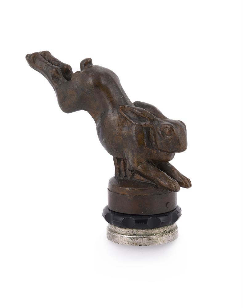 FRENCH SCHOOL, A BRONZED WOOD RADIATOR CAP OF A RUNNING HARE