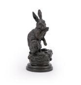 PROSPER LECOURTIER (FRENCH, 1851-1925), A RARE LARGE BRONZE MODEL OF A RABBIT GROOMING