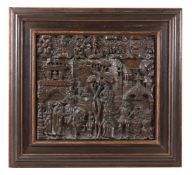 AN ELIZABETHAN CARVED OAK PANEL 'THE PRODIGAL SON' LATE 16TH CENTURY Panel 57 by 64cm Later frame