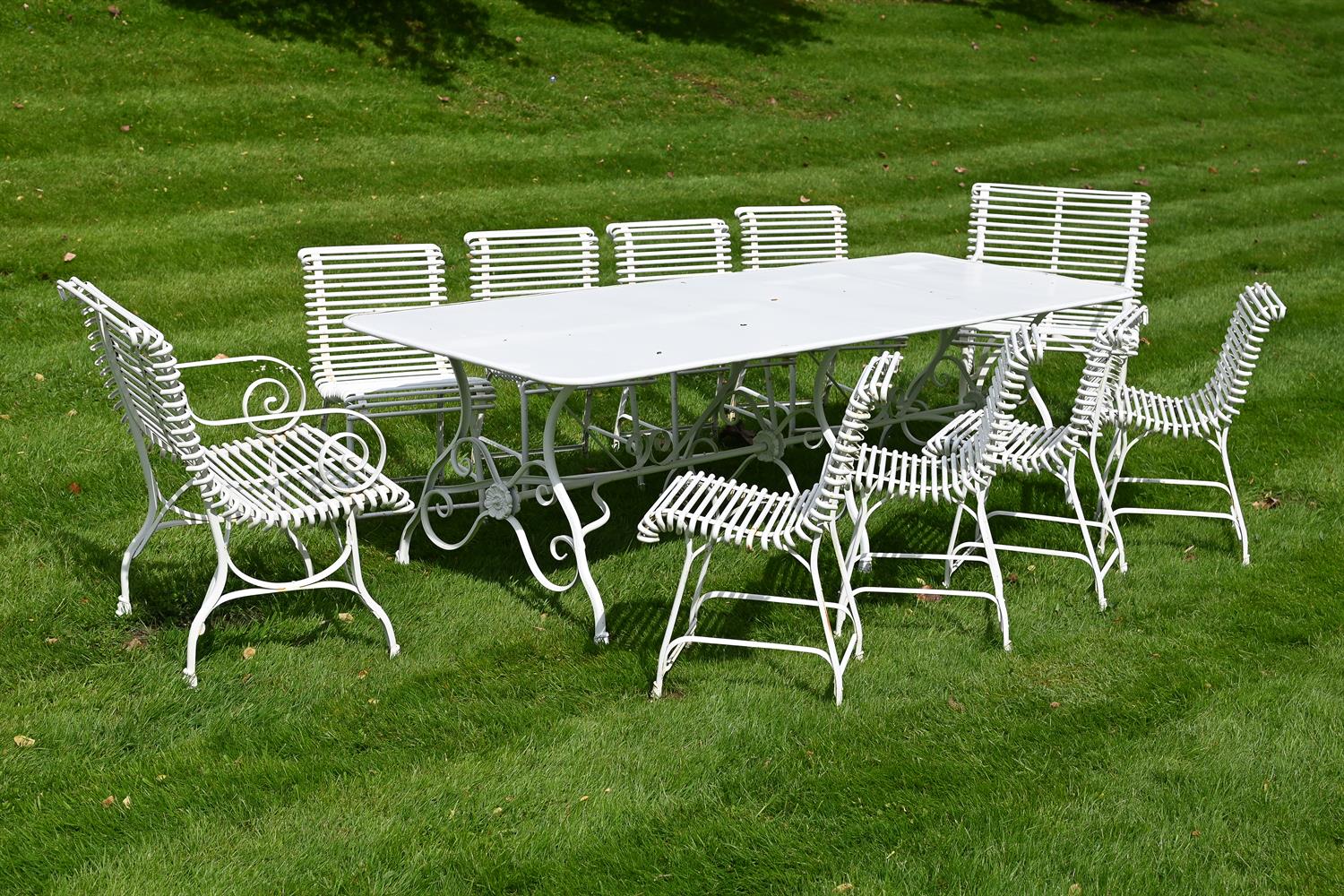 A HAND FORGED WHITE PAINTED IRON GARDEN OR ARRAS SUITE, MODERN