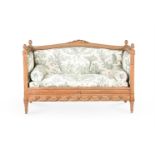 A FRENCH CARVED BEECH AND UPHOLSTERED SOFA, IN LOUIS XVI STYLE, LATE 19TH CENTURY