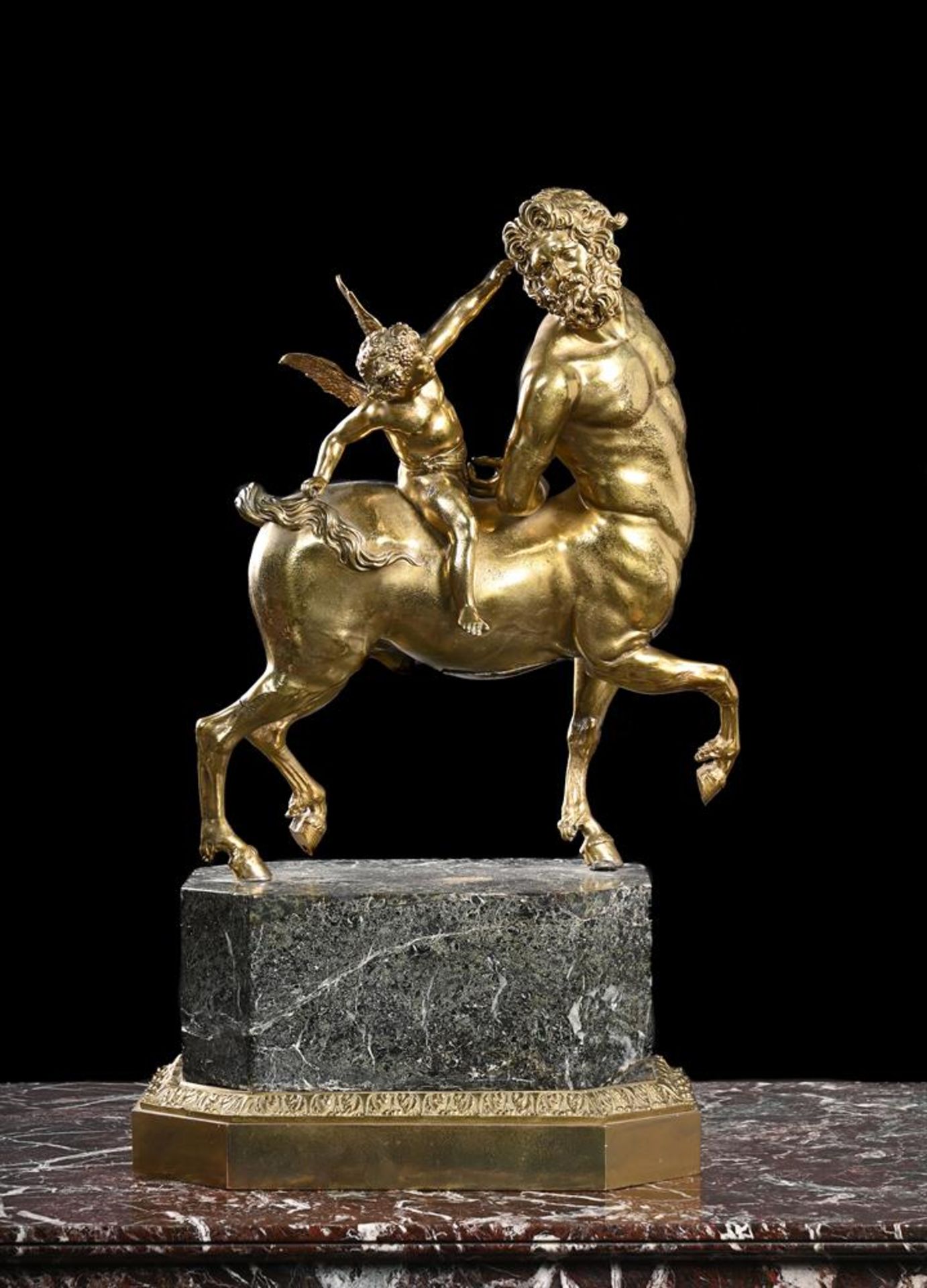 AFTER THE ANTIQUE, A LARGE 'GRAND TOUR' GILT BRONZE OF THE FURIETTI CENTAUR, EARLY 19TH CENTURY