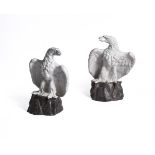 A PAIR OF CONTINENTAL WHITE-GLAZED TERRACOTTA MODELS OF EAGLES, EARLY 20TH CENTURY