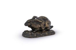 IN THE MANNER OF ANTOINE-LOUIS BARYE, A BRONZE MODEL OF A CROUCHING RABBIT