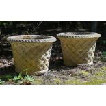 A SET OF EIGHT COMPOSITION STONE GARDEN URNS, OF HADDON BASKETWEAVE FORM, LATE 20TH CENTURY