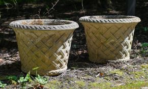 A SET OF EIGHT COMPOSITION STONE GARDEN URNS, OF HADDON BASKETWEAVE FORM, LATE 20TH CENTURY