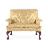 A MAHOGANY AND UPHOLSTERED SETTEE, IN GEORGE II IRISH STYLE, 19TH CENTURY