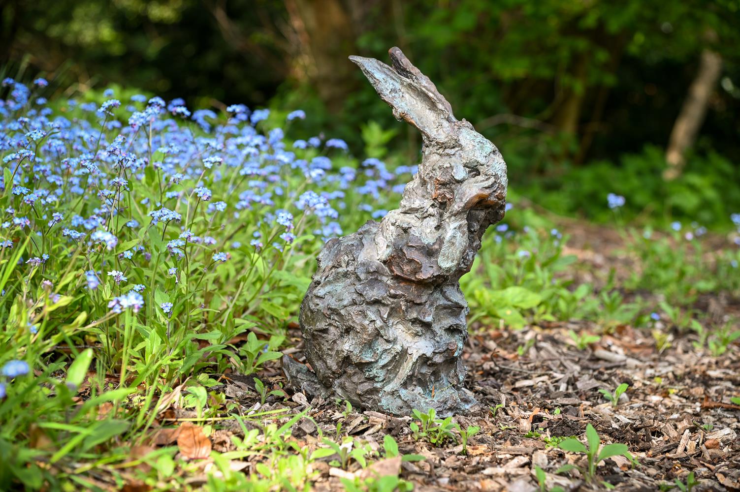 λ NICOLA HICKS (BRITISH, 1960- ), A LIMITED EDITION BRONZE MODEL OF A RABBIT GROOMING ITS FACE