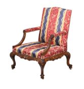 A CARVED MAHOGANY OPEN ARMCHAIR, IN GEORGE II STYLE