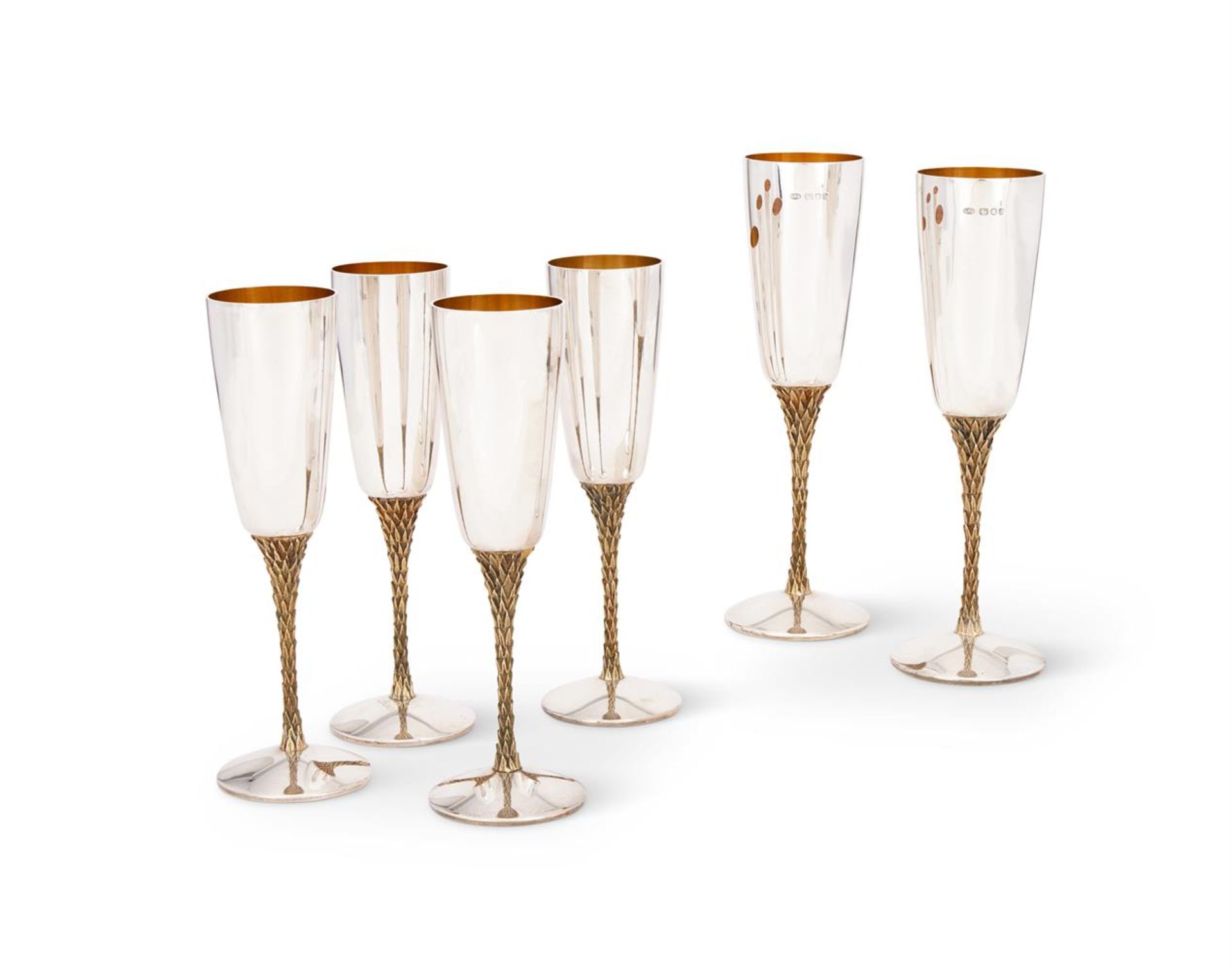 A SET OF SIX SILVER CHAMPAGNE FLUTES