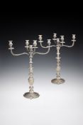 A PAIR OF VICTORIAN SILVER FIVE LIGHT CANDELABRA