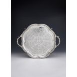 AN EARLY VICTORIAN SILVER TWIN HANDLED SHAPED CIRCULAR TRAY