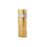 CHRISTIAN DIOR, A DIAMOND AND GOLD COLOURED LIGHTER