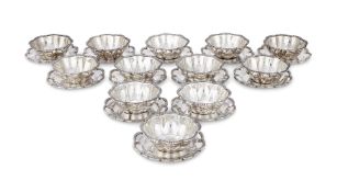 A CASED SET OF TWELVE EGYPTIAN SILVER COLOURED SHAPED CIRCULAR BOWLS AND DISHES