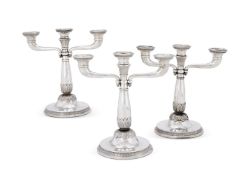A SET OF THREE FRENCH ELECTRO-PLATED THREE LIGHT CANDELABRA
