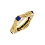 ANDREW GRIMA, A SHAPED 18 CARAT GOLD AND LAPIS LAZULI BAND RING, LONDON 1972