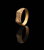 AN EARLY 15TH CENTURY ICONOGRAPHIC GOLD RING, SAINT JOHN THE BAPTIST, CIRCA 1430