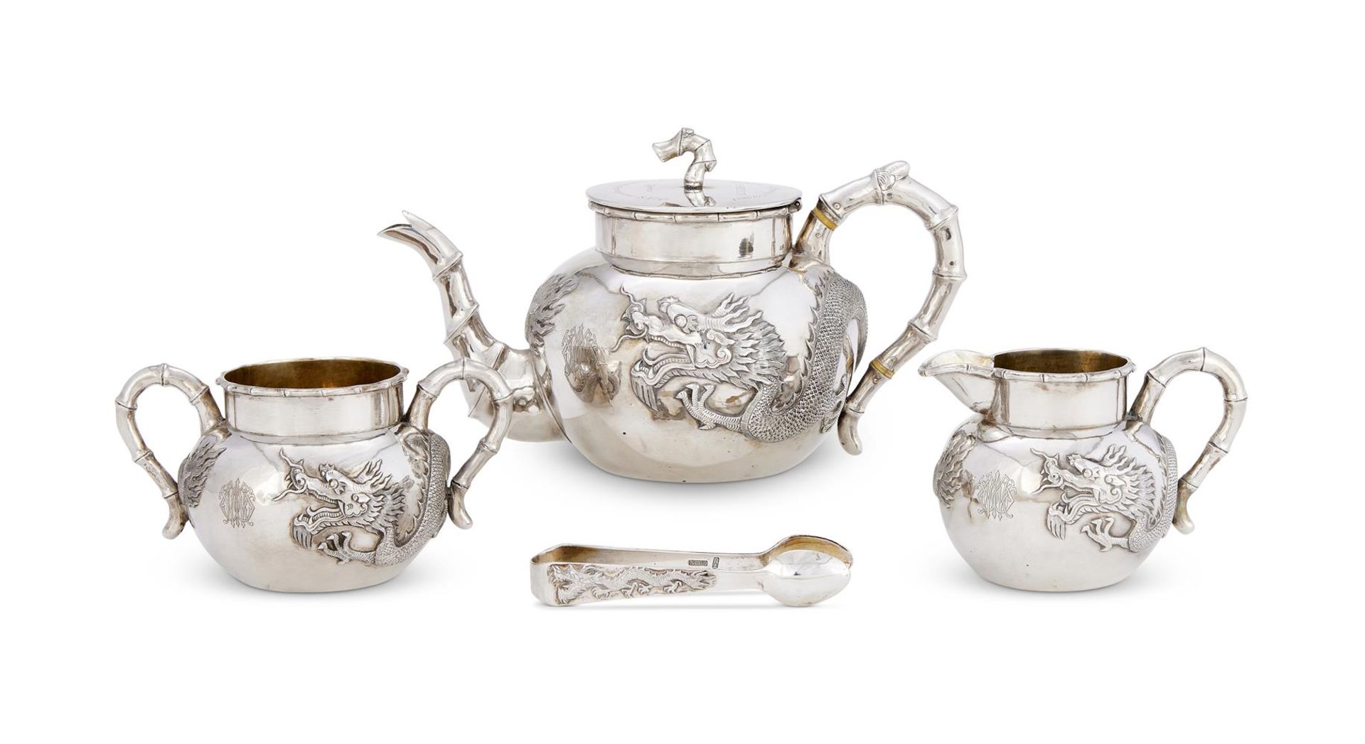 Y A CASED CHINESE SILVER FOUR PIECE CIRCULAR TEA SET