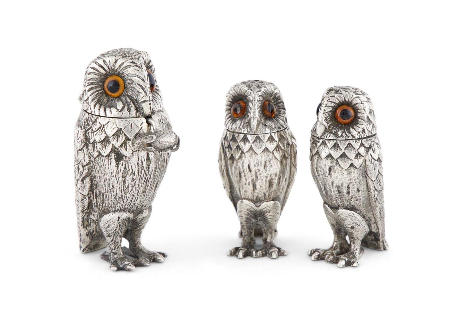 A SILVER THREE PIECE OWL CRUET SET