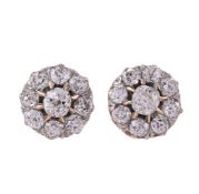 A PAIR OF LATE VICTORIAN AND LATER DIAMOND CLUSTER EAR STUDS
