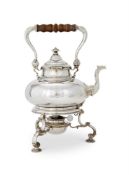 A SILVER KETTLE ON STAND