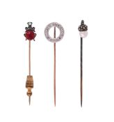 THREE ANTIQUE AND LATER GEM SET STICK PINS