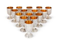 A SET OF FIFTEEN SILVER COLOURED CUPS