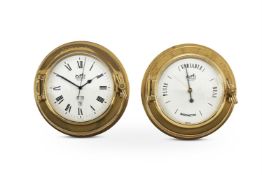 HERMÈS, A BRASS PORTHOLE DESK CLOCK WITH DAY AND DATE